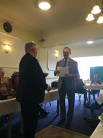 Herbert Rowsell receiving the Rotary Foundation Certificate from PDG Derek Newman.